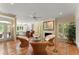 Inviting sunroom with wicker seating, tiled floors, and large windows offering serene views of the surrounding landscape at 4161 Thunderbird Se Dr, Marietta, GA 30067