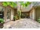Stone patio with fireplace and lush greenery creating a private outdoor living space at 4161 Thunderbird Se Dr, Marietta, GA 30067