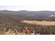 Scenic aerial view of the property's location amidst lush greenery and rolling hills at 46 Centerport Dr, White, GA 30184