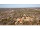 Aerial view of the property and neighborhood with sprawling trees and natural surroundings at 46 Centerport Dr, White, GA 30184