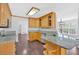 Kitchen with granite countertops, stainless steel appliances, and light wood cabinetry at 46 Centerport Dr, White, GA 30184