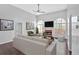 Bright living room with a fireplace, high ceilings, lots of natural light and neutral décor at 46 Centerport Dr, White, GA 30184