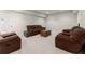 Finished basement with neutral carpeting, comfortable seating, and a rustic coffee table at 6625 Baywood Run, Cumming, GA 30041