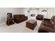 Finished basement with comfortable seating, neutral carpeting and decorative accents at 6625 Baywood Run, Cumming, GA 30041