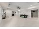 Finished basement featuring neutral carpeting, recessed lighting, game table and fitness equipment at 6625 Baywood Run, Cumming, GA 30041