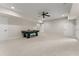 Large finished basement features neutral carpeting, recessed lighting, and game area at 6625 Baywood Run, Cumming, GA 30041