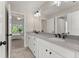 Elegant bathroom with double vanity, white cabinets, gray countertop, and modern lighting at 6625 Baywood Run, Cumming, GA 30041