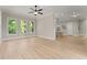 Spacious room with hardwood floors and multiple windows offering ample natural light at 6625 Baywood Run, Cumming, GA 30041