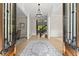 Grand foyer entrance with wood floors, an elegant chandelier, and beautiful woodwork throughout at 6625 Baywood Run, Cumming, GA 30041