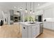 Modern kitchen featuring a center island with marble countertops and stainless steel appliances at 6625 Baywood Run, Cumming, GA 30041