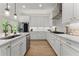 Well-lit kitchen featuring white cabinetry, marble countertops, and stainless steel appliances at 6625 Baywood Run, Cumming, GA 30041