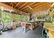 Spacious workshop with exposed wood beams, natural light, and lots of room for projects at 6625 Baywood Run, Cumming, GA 30041