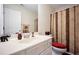 Cozy bathroom features a single sink vanity and a shower with a patterned curtain at 780 Nehemiah Sw Ln, Atlanta, GA 30331
