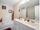 Bathroom features dual sinks, a large mirror, and a separate tub and shower at 780 Nehemiah Sw Ln, Atlanta, GA 30331