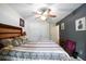 Relaxing bedroom features a ceiling fan, closet, night stand, and neutral walls at 780 Nehemiah Sw Ln, Atlanta, GA 30331
