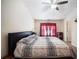 Cozy bedroom with neutral walls, ceiling fan, and a comfortable queen-sized bed at 780 Nehemiah Sw Ln, Atlanta, GA 30331
