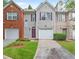 Charming two-story townhome with a well-manicured lawn and attached garage at 780 Nehemiah Sw Ln, Atlanta, GA 30331