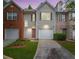 Charming two-story home with a well-manicured lawn, attached garage, and inviting front entrance at 780 Nehemiah Sw Ln, Atlanta, GA 30331