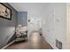 Inviting hallway with hard surface floors, white paint, and neutral decor at 780 Nehemiah Sw Ln, Atlanta, GA 30331