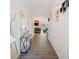 A hallway with lots of wall decor that leads to a bright and open living space at 780 Nehemiah Sw Ln, Atlanta, GA 30331