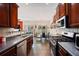 Spacious kitchen overlooks the dining area and boasts stainless steel appliances and dark wood cabinetry at 780 Nehemiah Sw Ln, Atlanta, GA 30331