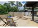 Expansive backyard patio featuring fire pit and modern block privacy wall, perfect for relaxing at 1195 Russell Dr, Decatur, GA 30030