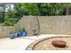 Backyard features a hanging chair and decorative concrete block wall accented with planted foliage at 1195 Russell Dr, Decatur, GA 30030