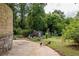 Lush backyard showcasing a playset, a chicken coop, and a garden space, perfect for hobby farming at 1195 Russell Dr, Decatur, GA 30030