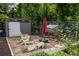Outdoor space featuring seating, a shed, and a chicken coop, creating a versatile and functional backyard setup at 1195 Russell Dr, Decatur, GA 30030