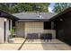 Backyard concrete patio with dining set and accent wall featuring repeating square motif concrete blocks at 1195 Russell Dr, Decatur, GA 30030