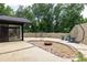 Outdoor patio with decorative concrete block walls and gravel fire pit, perfect for entertaining at 1195 Russell Dr, Decatur, GA 30030