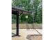 Backyard featuring a concrete patio, concrete block privacy wall, seating, and manicured landscaping at 1195 Russell Dr, Decatur, GA 30030