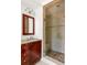 Updated bathroom featuring a glass shower with neutral tile surround and a granite vanity at 1195 Russell Dr, Decatur, GA 30030