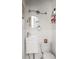 Compact bathroom featuring a pedestal sink, clean white beadboard, and a modern faucet at 1195 Russell Dr, Decatur, GA 30030