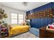 Cozy bedroom featuring charming decor, wood floors, and a bright window for natural light at 1195 Russell Dr, Decatur, GA 30030