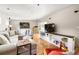 Bright living area featuring hardwood floors, large sectional and built-in shelving at 1195 Russell Dr, Decatur, GA 30030
