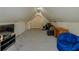 This attic offers ample storage space with a vaulted ceiling, featuring carpeting and recessed lighting at 160 Vinnys Way, Covington, GA 30014