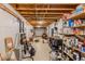 Unfinished basement workshop featuring open ceiling, pegboard walls, shelving and tool storage options at 160 Vinnys Way, Covington, GA 30014