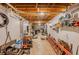 Unfinished basement featuring pegboard walls, exposed ductwork and a work bench area at 160 Vinnys Way, Covington, GA 30014