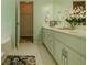 Bathroom showcasing a double sink vanity with a walk-in closet nearby at 160 Vinnys Way, Covington, GA 30014
