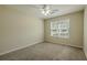 This room features neutral carpeting and a window with blinds, offering natural light and a simple design at 160 Vinnys Way, Covington, GA 30014