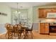 Cozy dining area featuring a wood table with seating for six and natural light from windows at 160 Vinnys Way, Covington, GA 30014