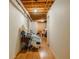 This hallway features laminate flooring and open ceiling, offering ample space and access to various rooms in the basement at 160 Vinnys Way, Covington, GA 30014