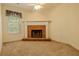 Living room boasts a charming brick fireplace, enhancing the cozy atmosphere at 160 Vinnys Way, Covington, GA 30014