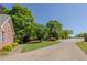 View down the street, with the house featuring brick exterior details at 160 Vinnys Way, Covington, GA 30014