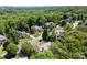 A high angle view of homes nestled among trees in a lush residential neighborhood at 1860 Hill Chase, Alpharetta, GA 30022