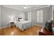 Bedroom with hardwood floors, bright natural light, and LED accent lights at 1860 Hill Chase, Alpharetta, GA 30022