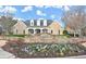 Inviting community entrance features stone signage, manicured flower beds, and a well-maintained building at 1860 Hill Chase, Alpharetta, GA 30022