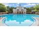 The community pool features lounge chairs and a clubhouse with a view of the pool at 1860 Hill Chase, Alpharetta, GA 30022