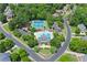 Aerial view features the community pool, tennis courts, parking lot, and surrounding residential neighborhood at 1860 Hill Chase, Alpharetta, GA 30022